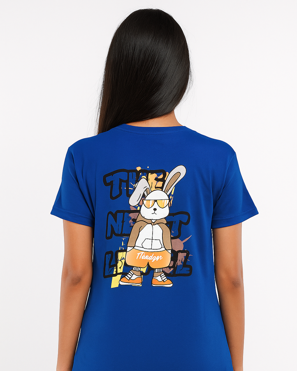 Person wearing a blue t-shirt with a cartoon character on the back